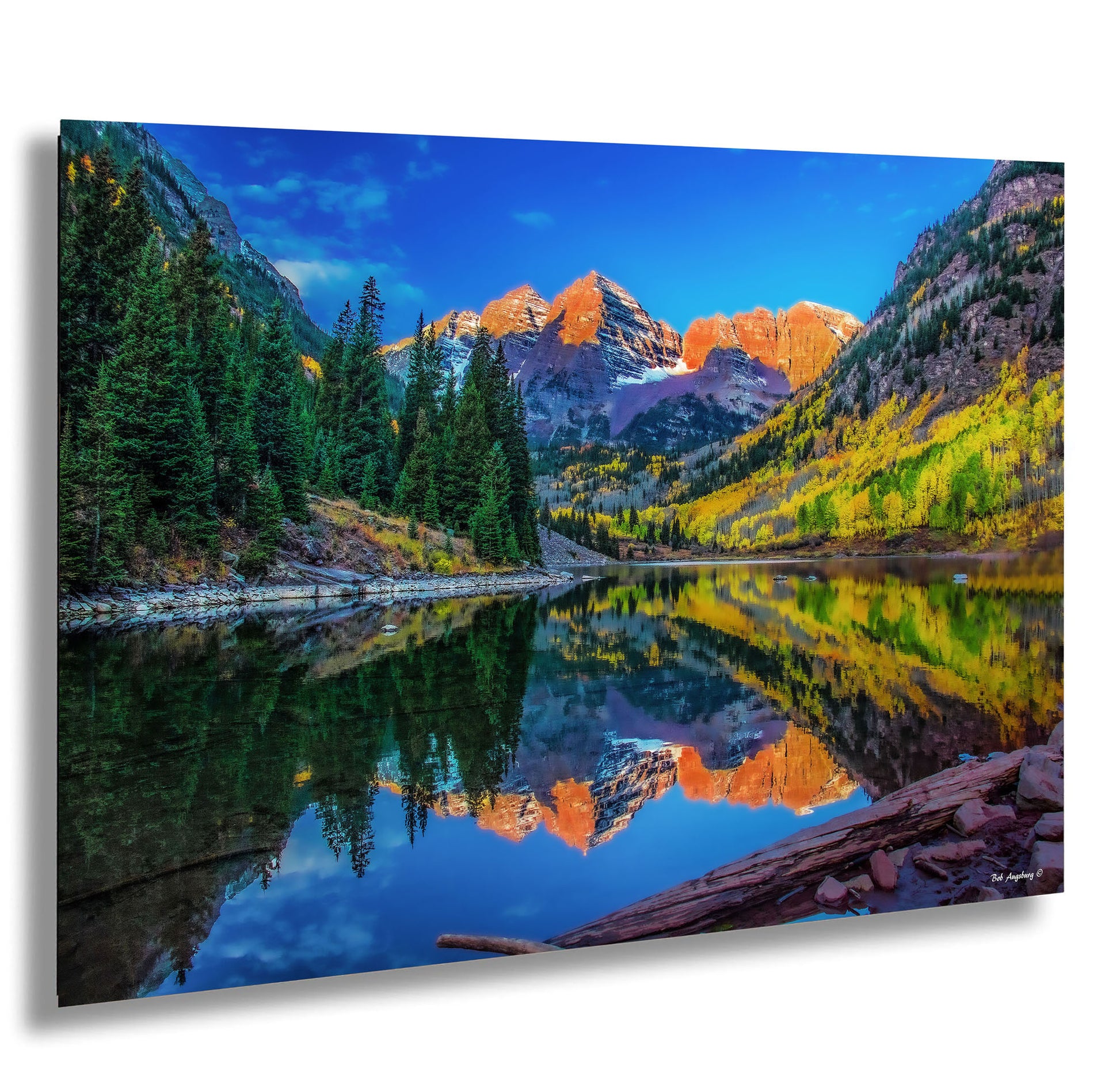 a mountain lake surrounded by trees and mountains