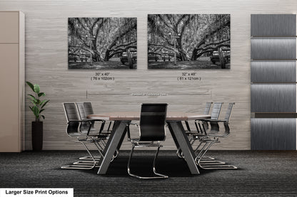a black and white photo of a table and chairs