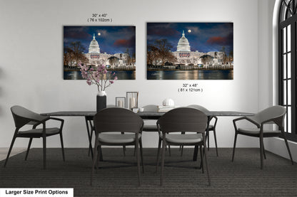 a dining room table with four chairs and a vase with flowers