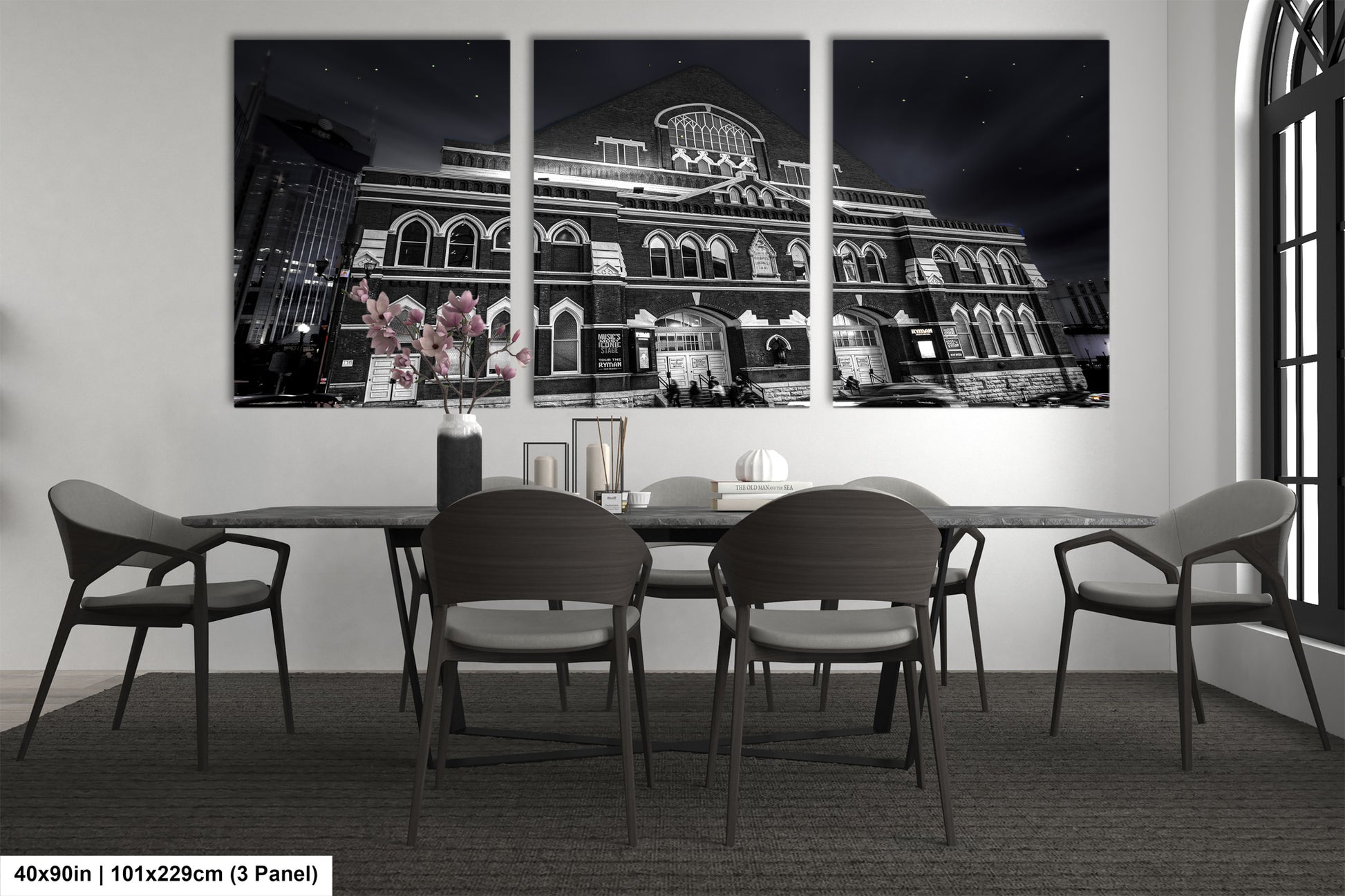 a black and white photo of a dining room