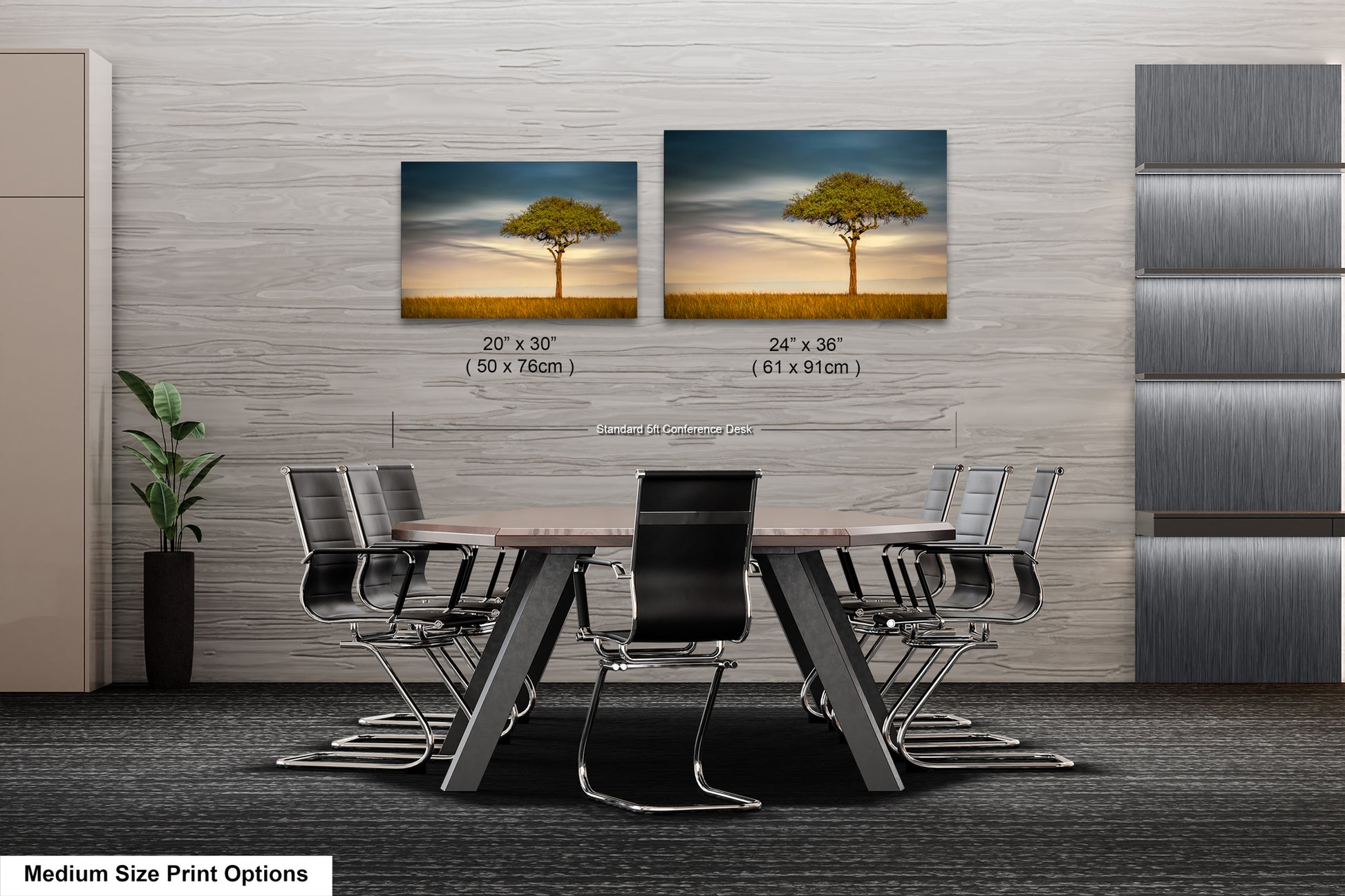 a dining room table with chairs and a picture of a tree on the wall