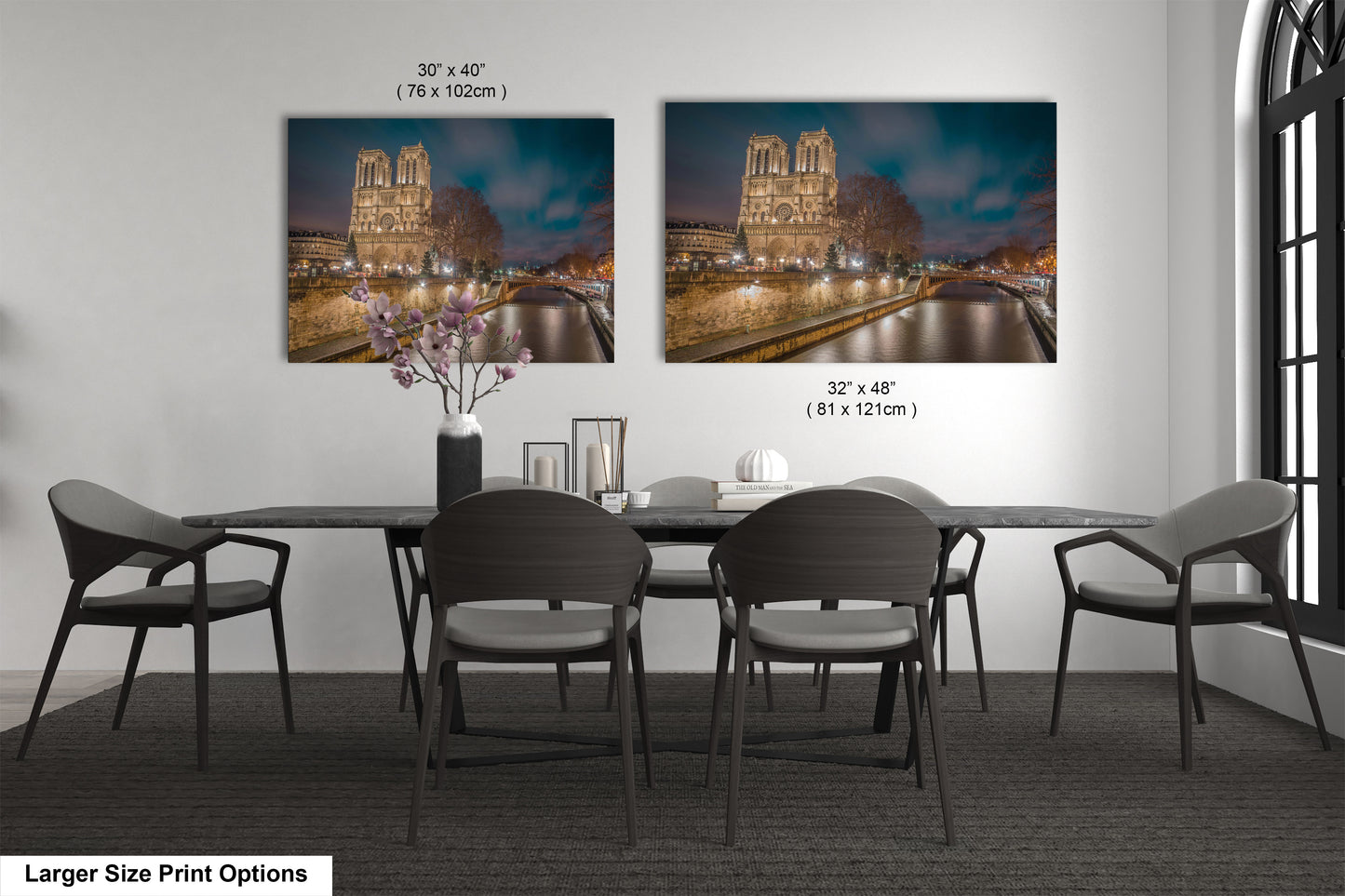 a dining room table with chairs and a vase of flowers