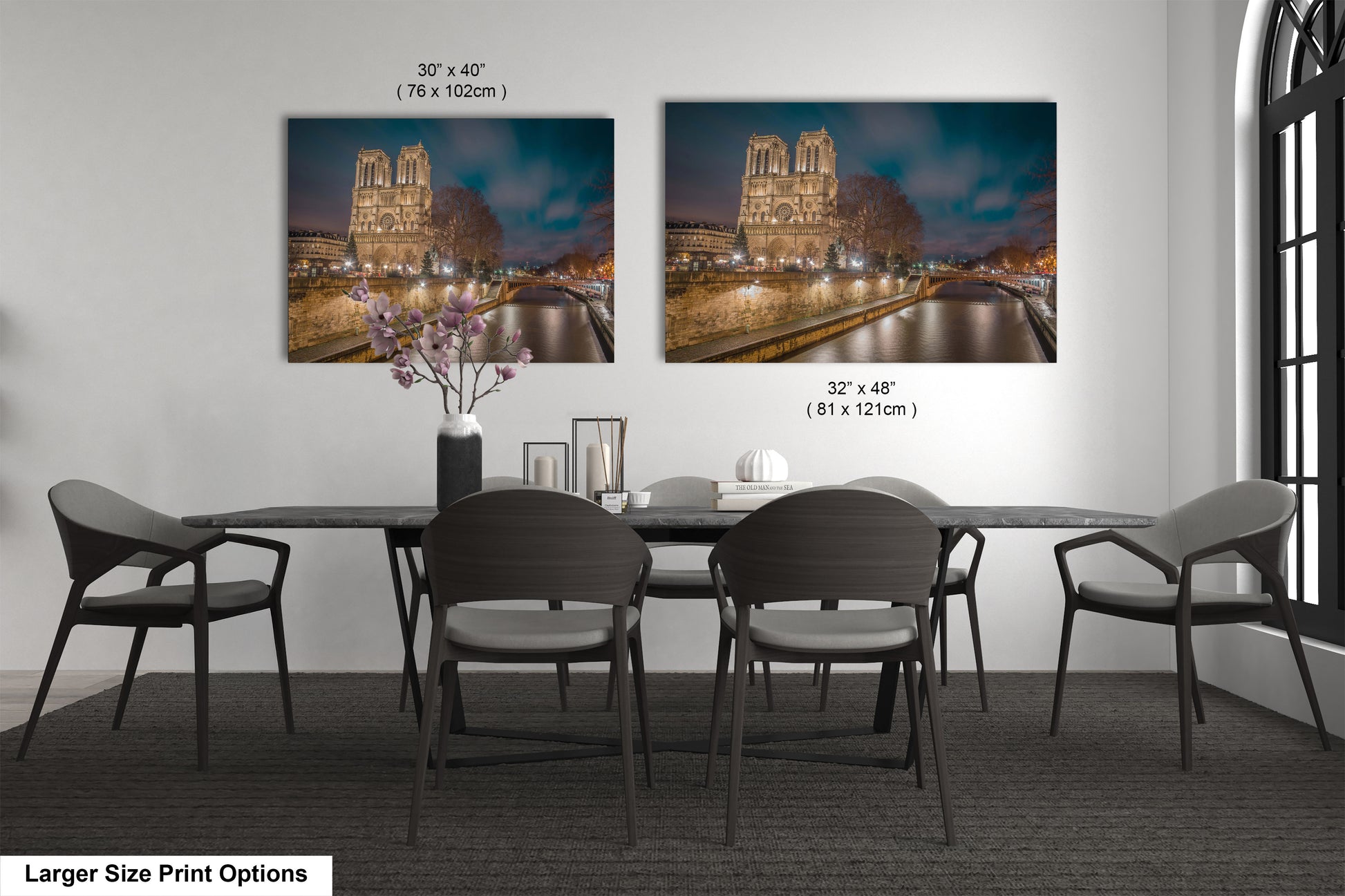 a dining room table with chairs and a vase of flowers