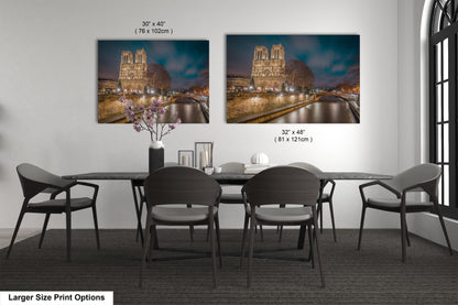 a dining room table with chairs and a vase of flowers