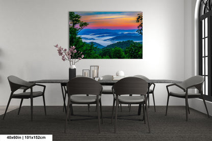 a dining room table with chairs and a painting on the wall
