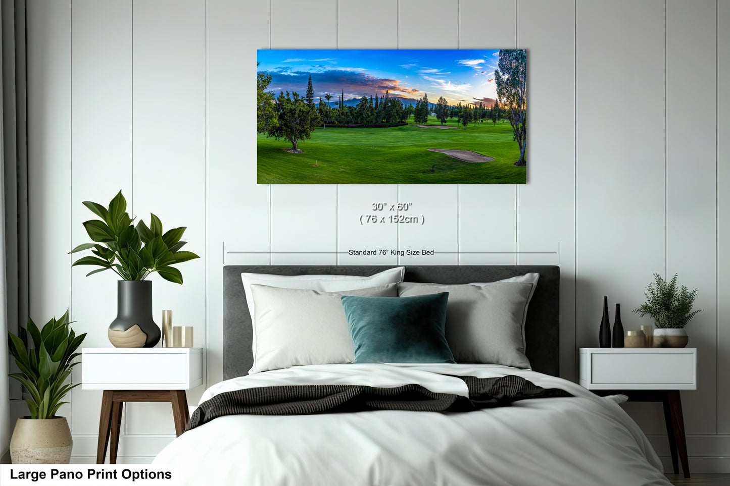 a bedroom with a large bed and a painting on the wall