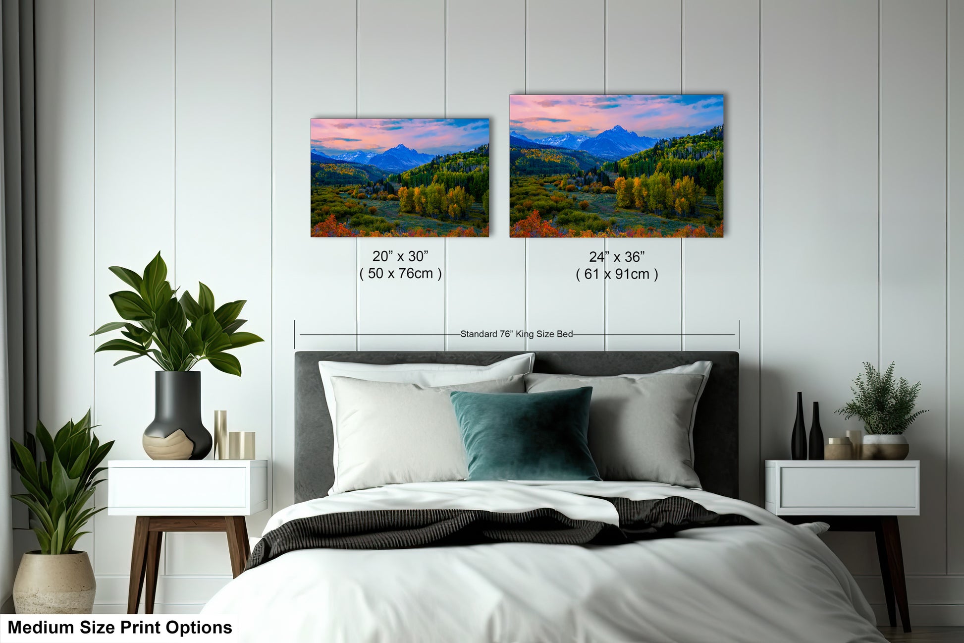 a bedroom with a bed and two paintings on the wall