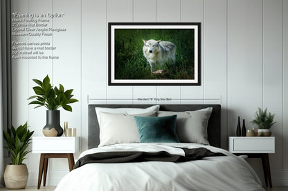 a bedroom with a bed and a picture hanging on the wall