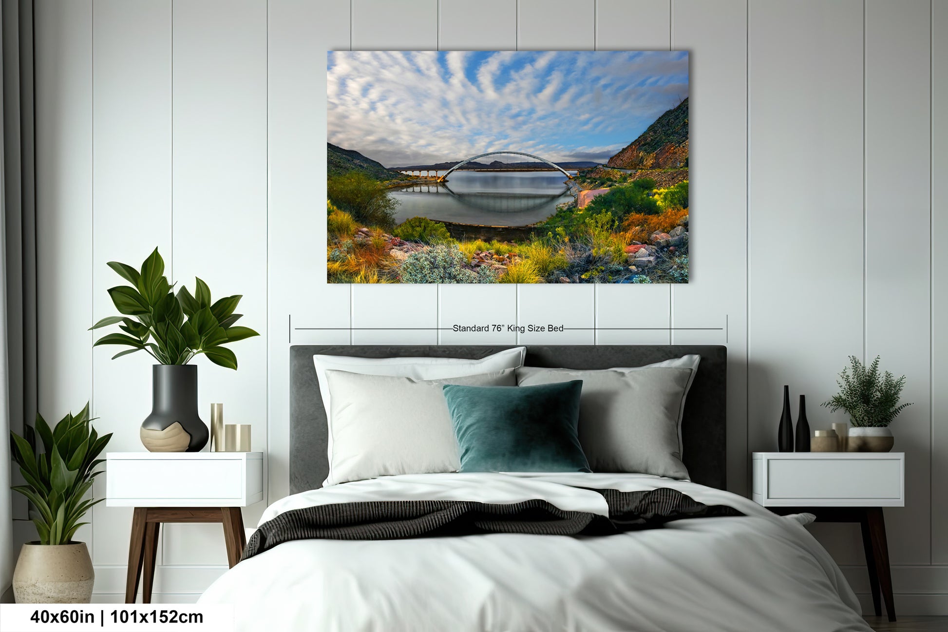 a bedroom with a bed and a painting on the wall