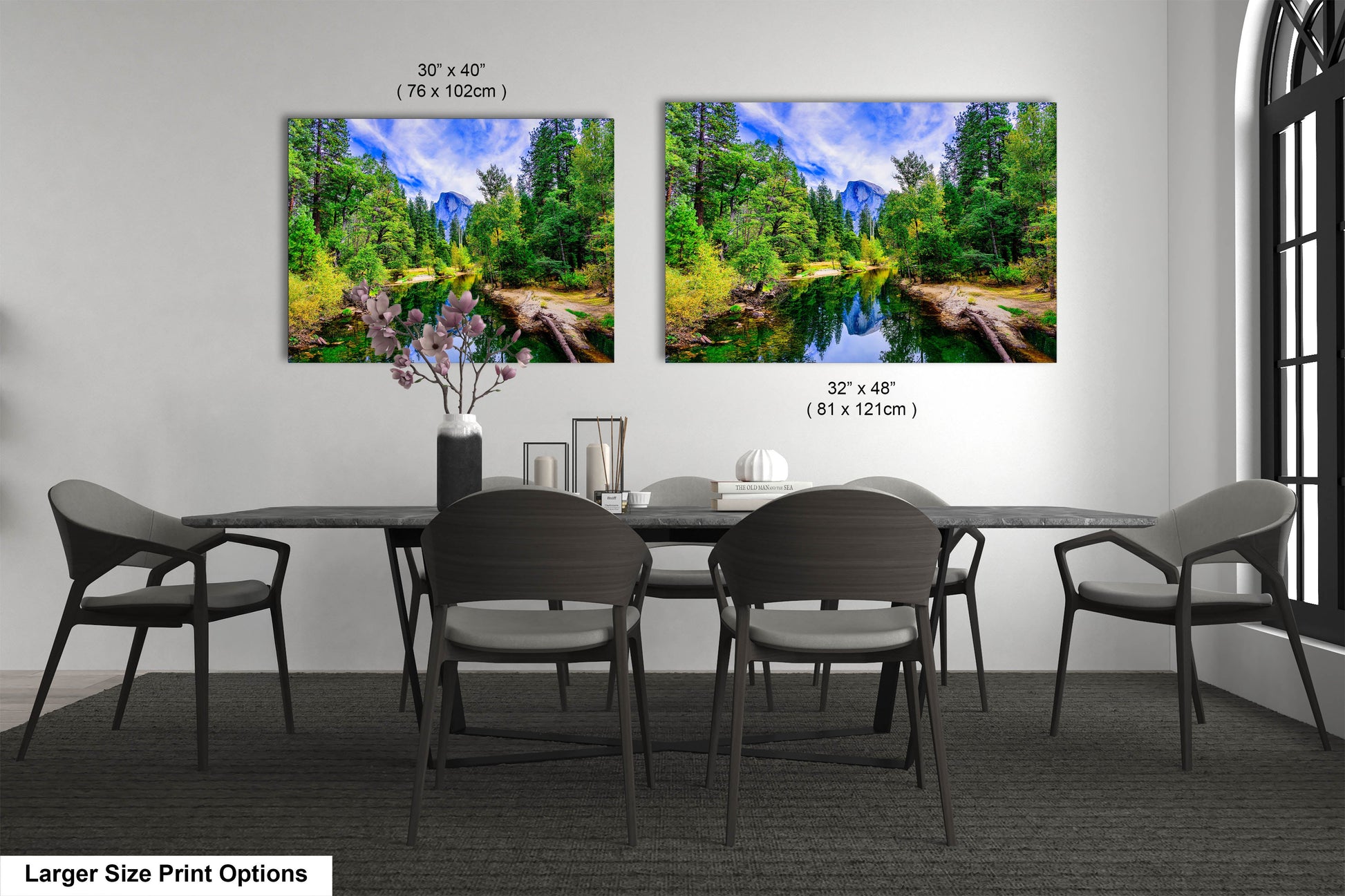 a dining room table with four chairs and two pictures on the wall