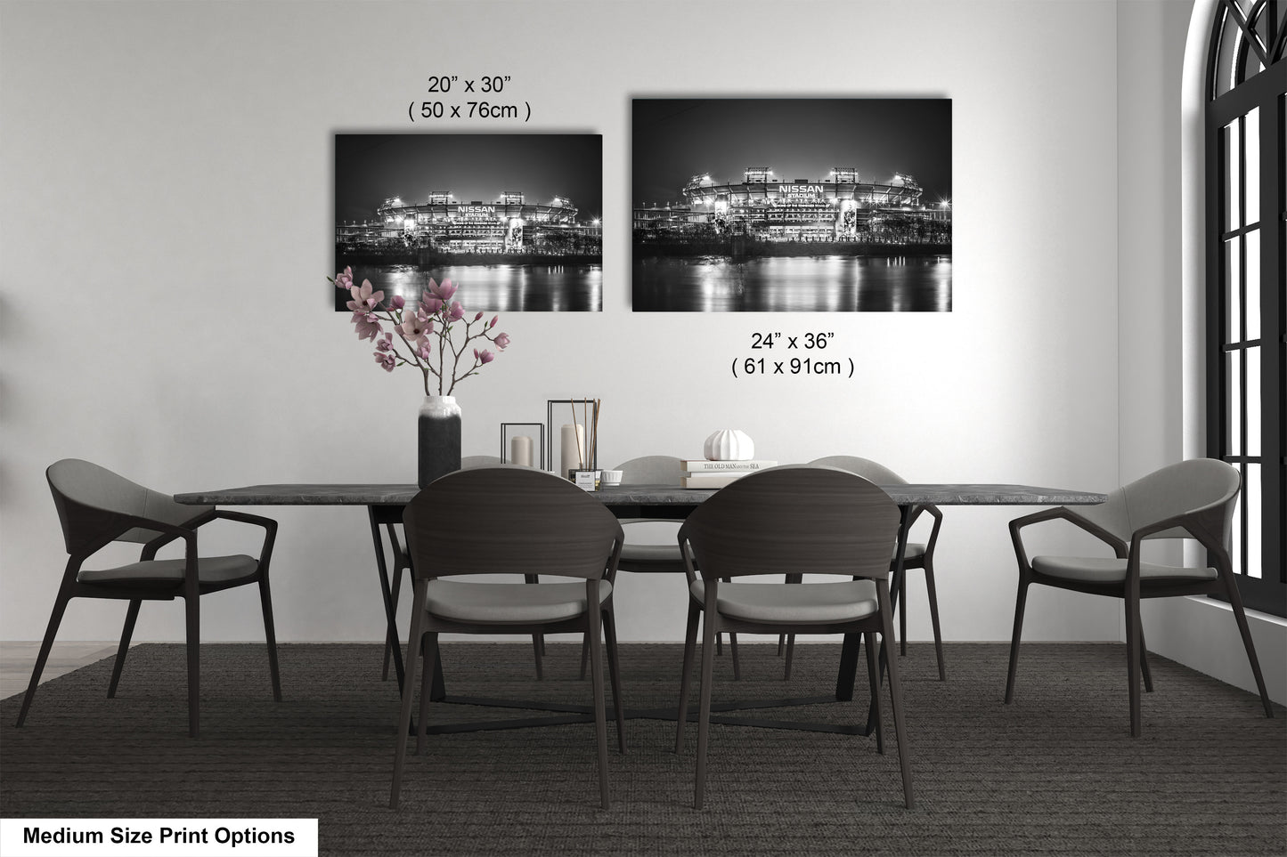 a dining table with four chairs and a vase of flowers