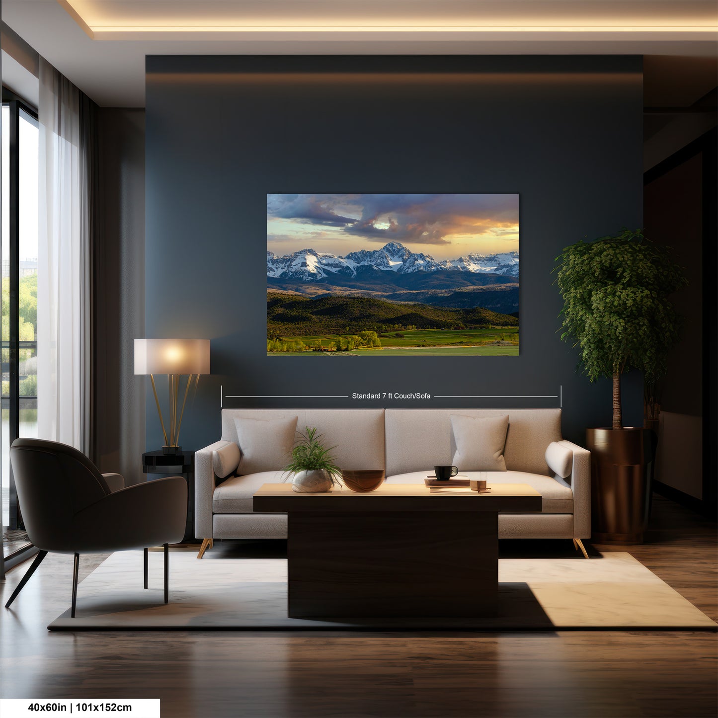 a modern living room with a large wall-mounted painting of a mountain landscape. The painting features a stunning view of snow-capped mountains under a vibrant sky. The room is furnished with a white sofa, a coffee table, and a potted plant, creating a cozy and inviting atmosphere.
