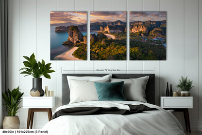 a bedroom with a bed and two paintings on the wall