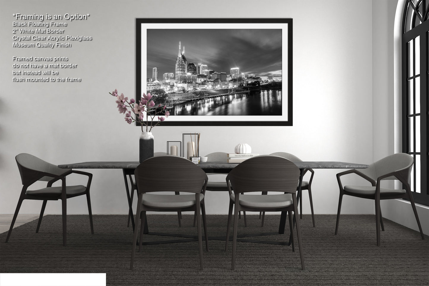 a black and white photo of a dining room table
