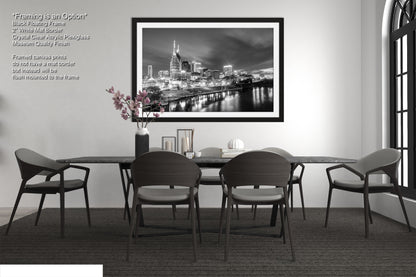 a black and white photo of a dining room table