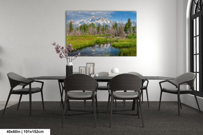 a dining room table with chairs and a painting on the wall