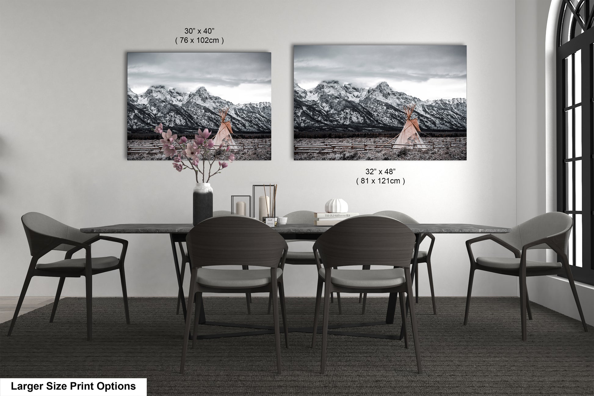 a dining room table with four chairs and a vase with flowers