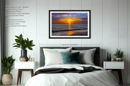 a bedroom with a bed and a picture on the wall