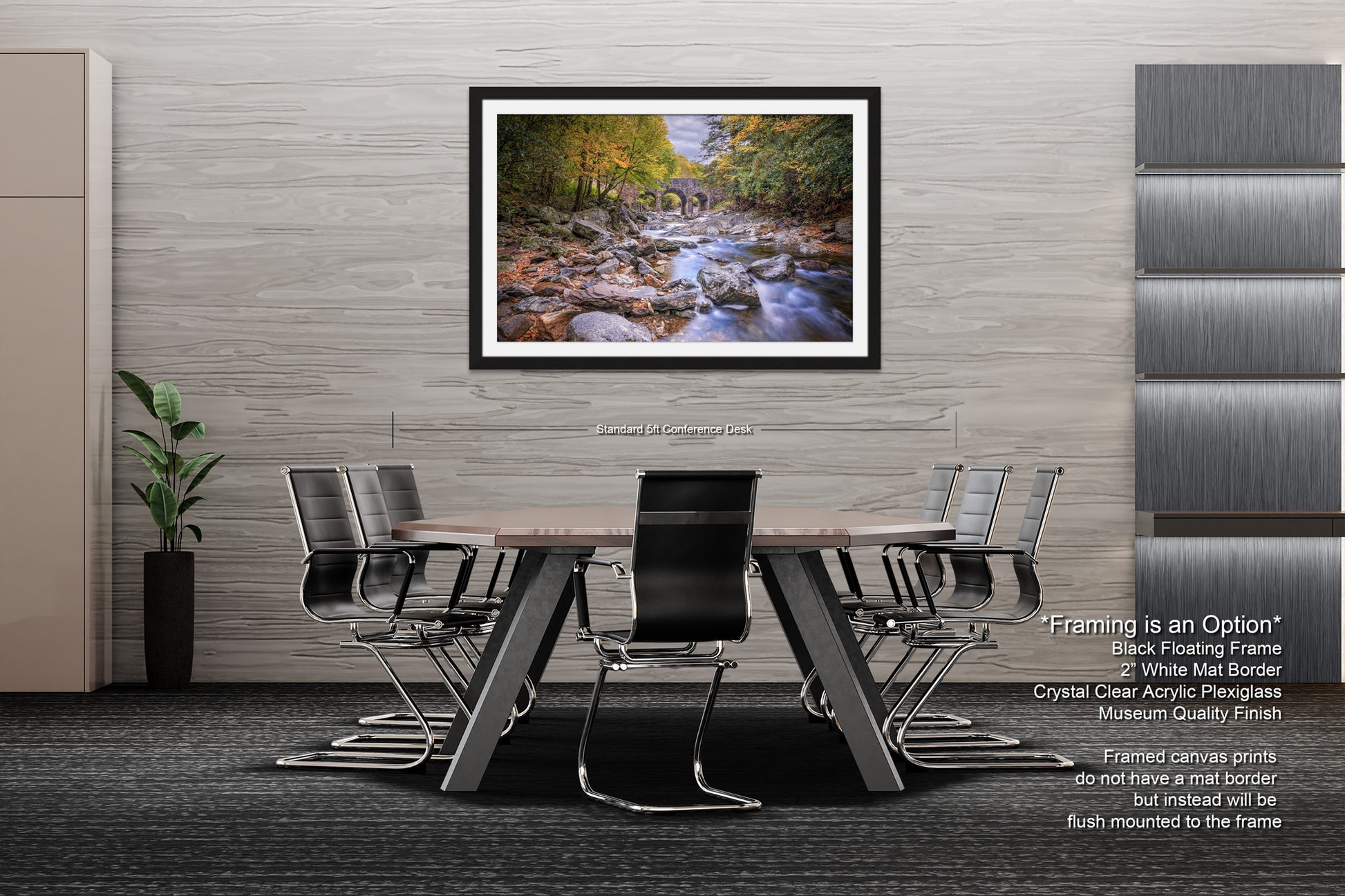 a dining room table with chairs and a picture hanging on the wall