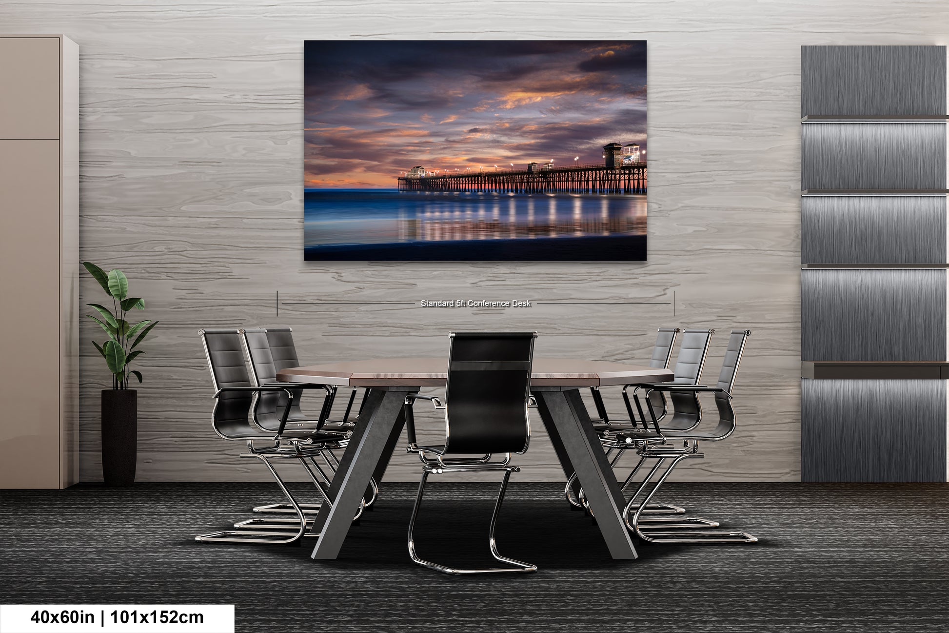 a dining room table with chairs and a painting on the wall