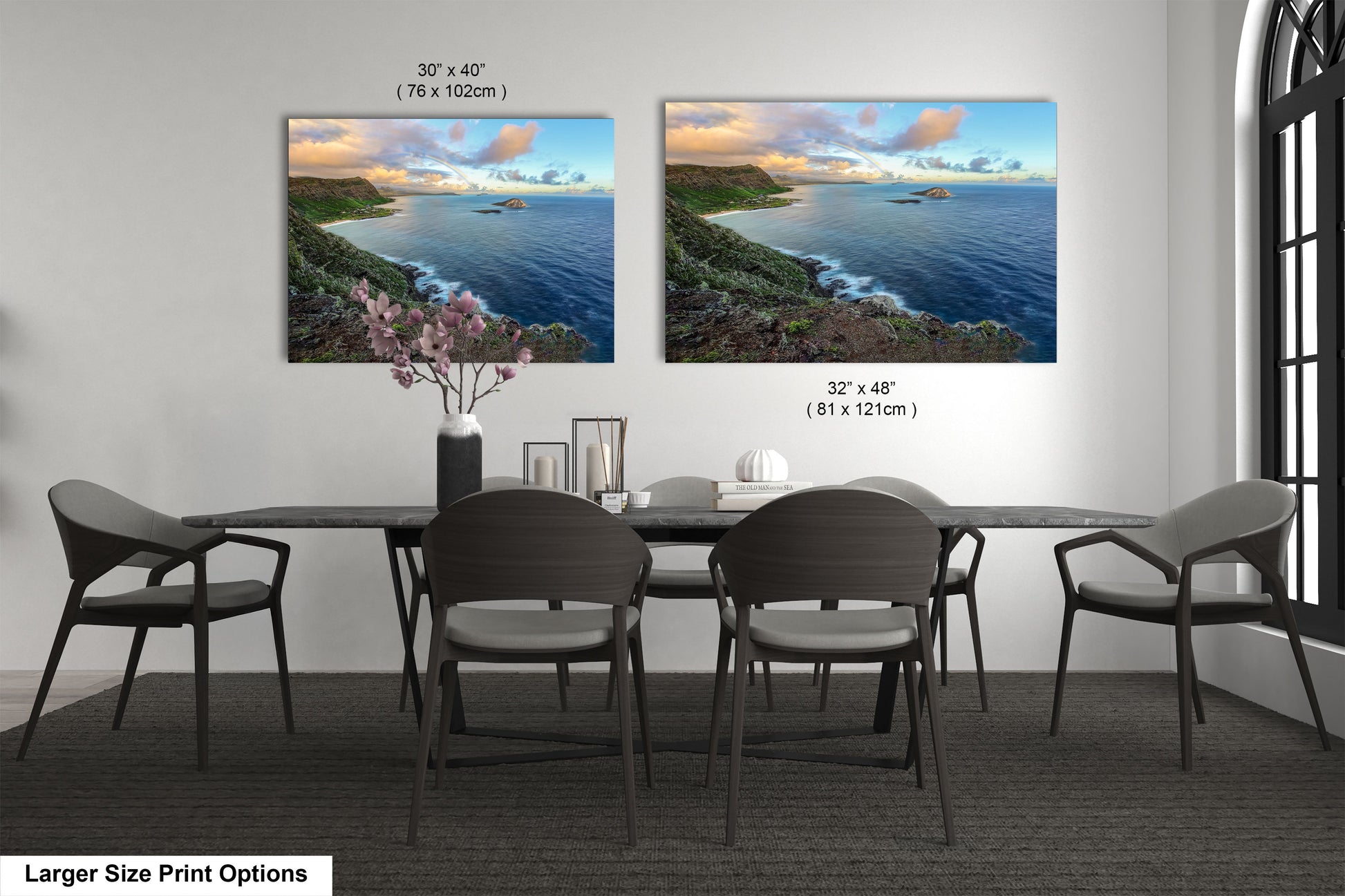 a dining room table with four chairs and two pictures on the wall
