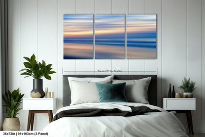 a bedroom scene with focus on the bed and the ocean