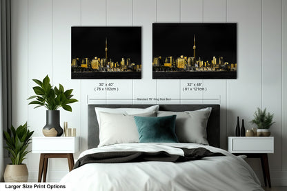 a bedroom with a bed and two pictures on the wall