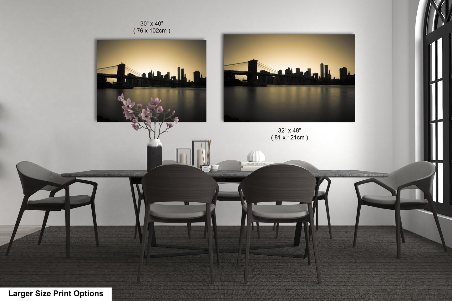 a dining table with four chairs and a vase of flowers