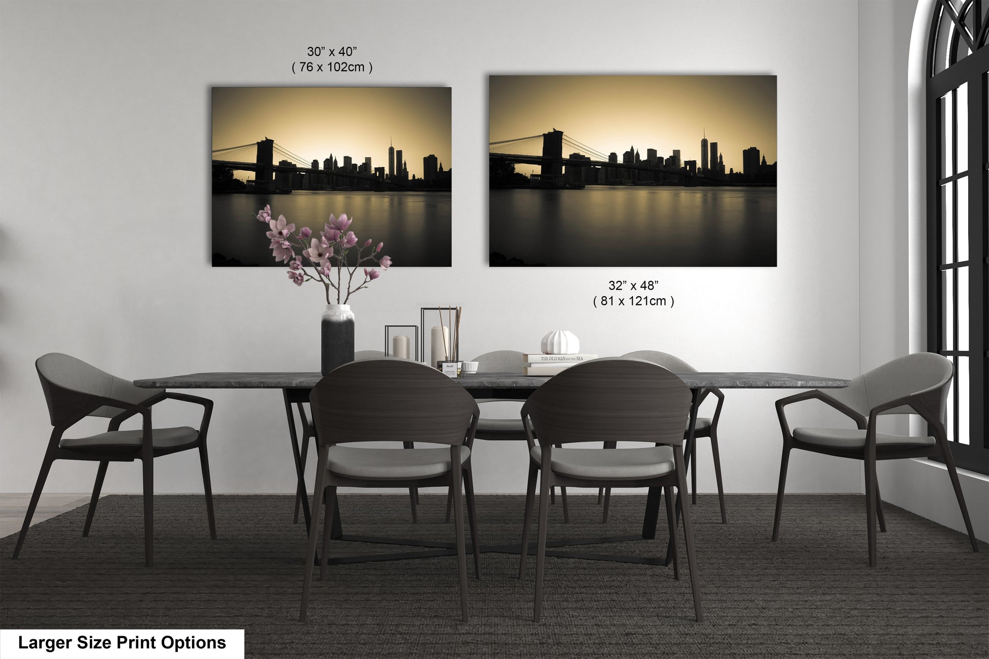 a dining table with four chairs and a vase of flowers