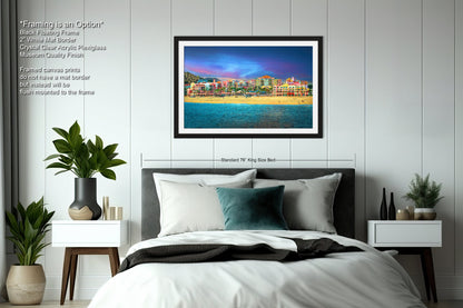 a bedroom with a large bed and a picture on the wall