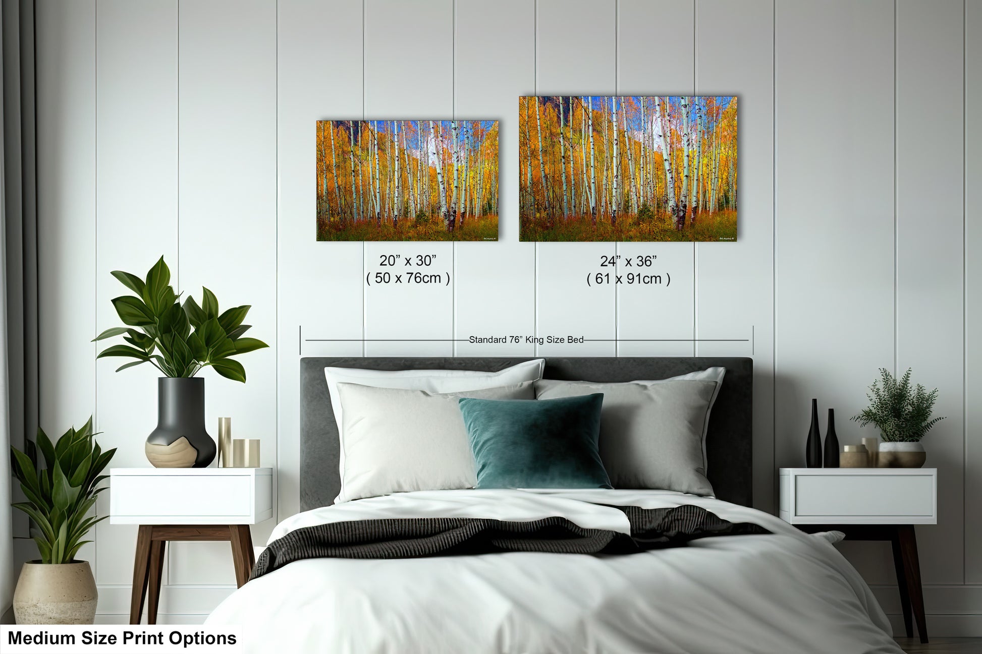 a bed room with a neatly made bed and two paintings on the wall