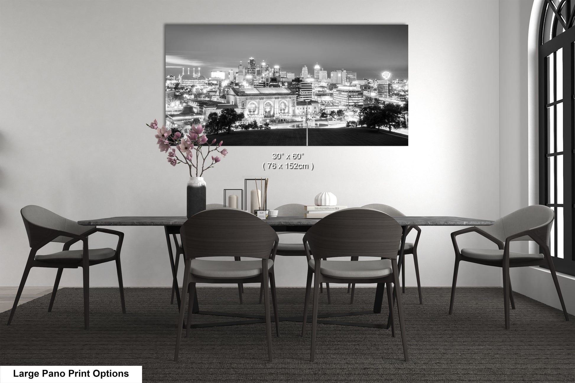 a black and white photo of a dining room table