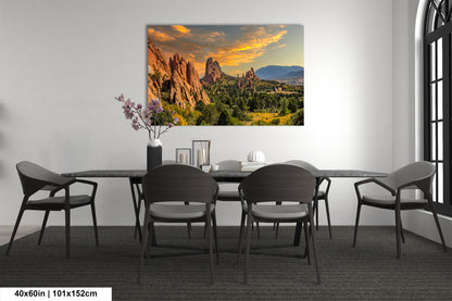 a dining room table with chairs and a painting on the wall