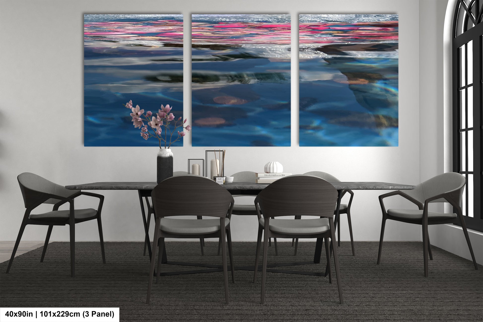 a dining room table with four chairs and a painting on the wall