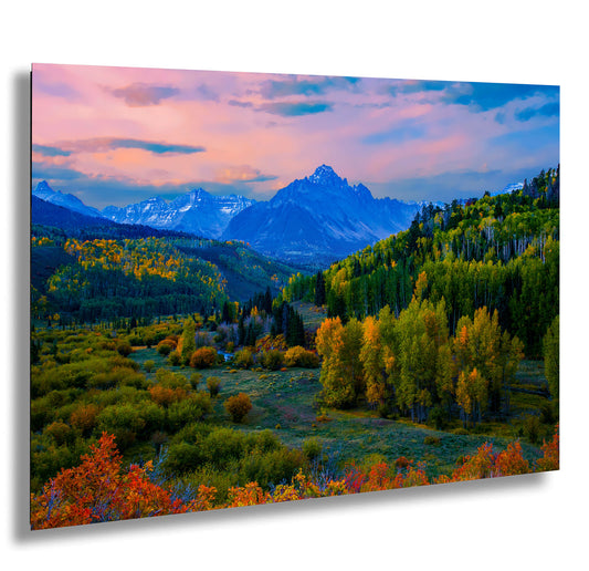 a painting of a mountain range with trees in the foreground