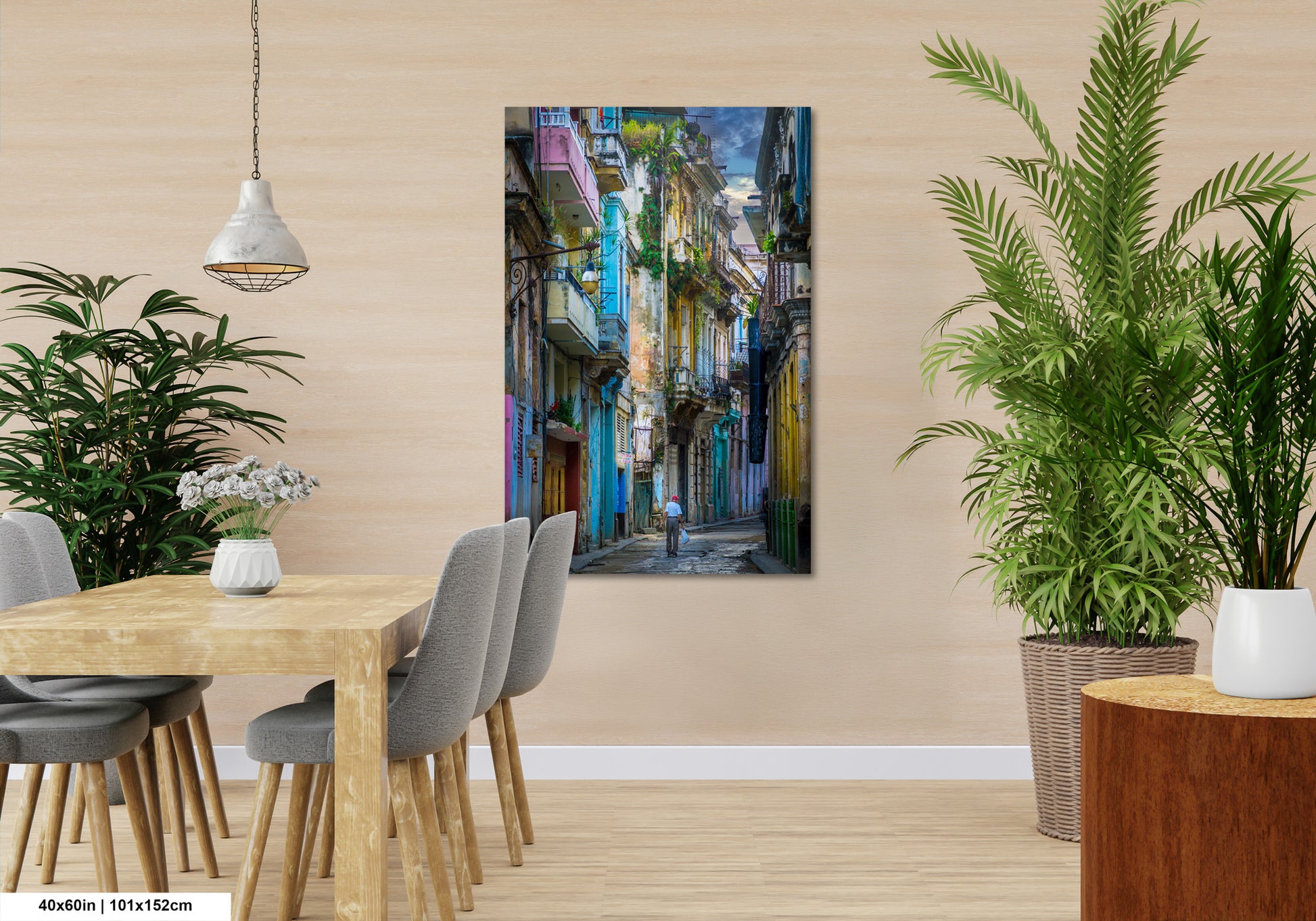 a room with a table and chairs and a painting on the wall