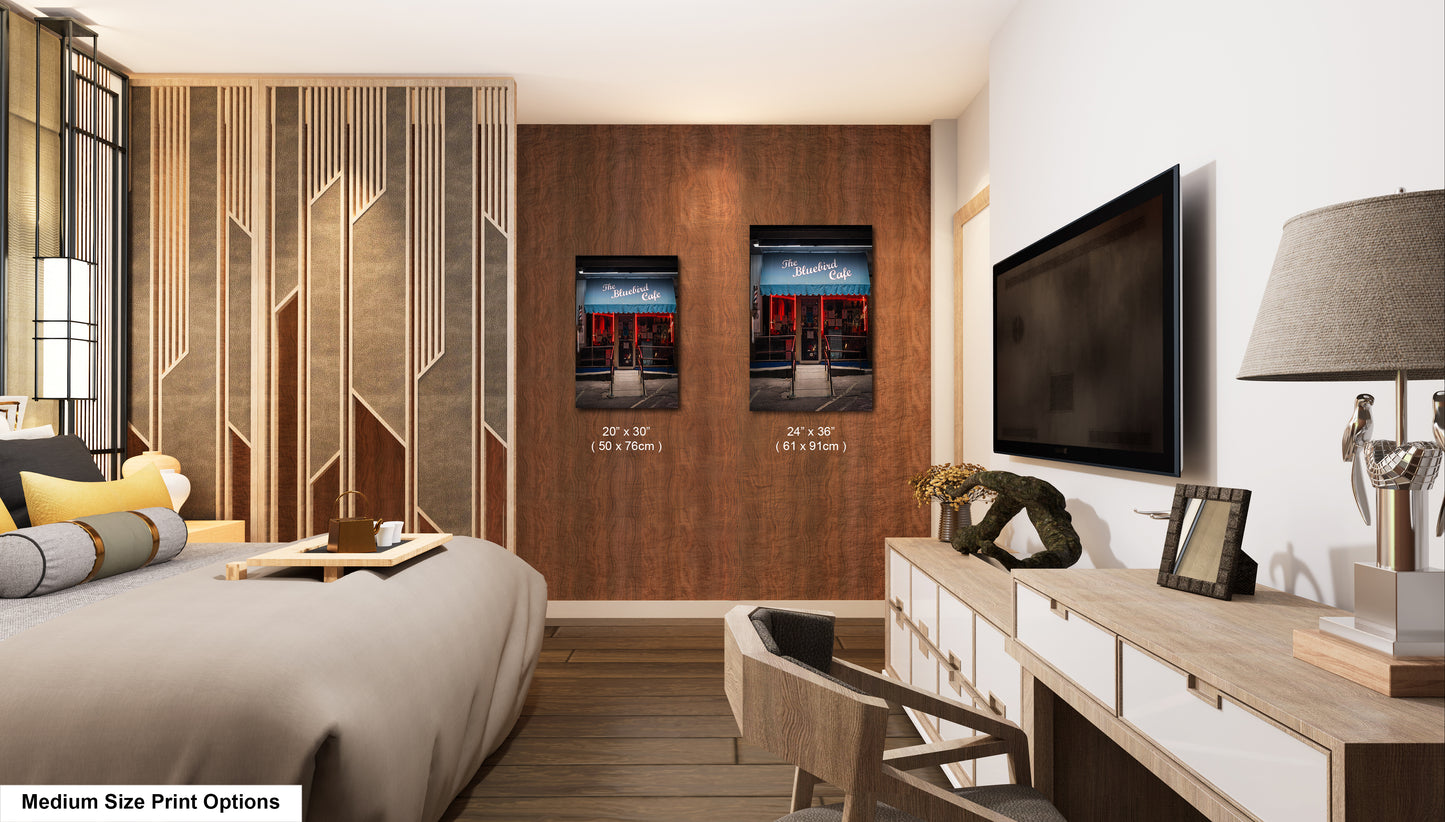 a bedroom with a large bed and a flat screen tv