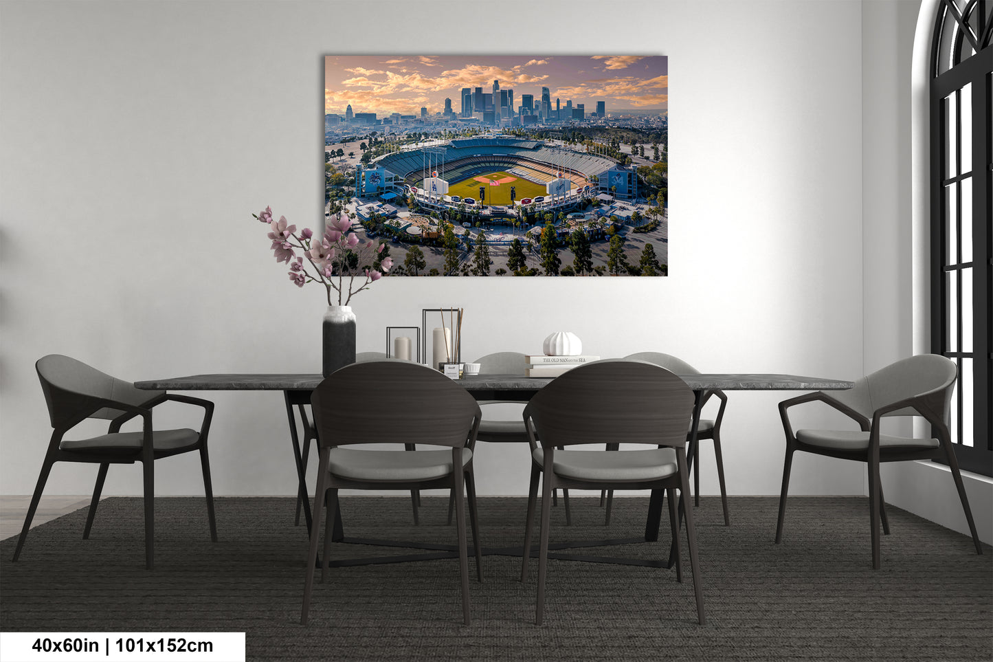a dining room table with a view of a stadium