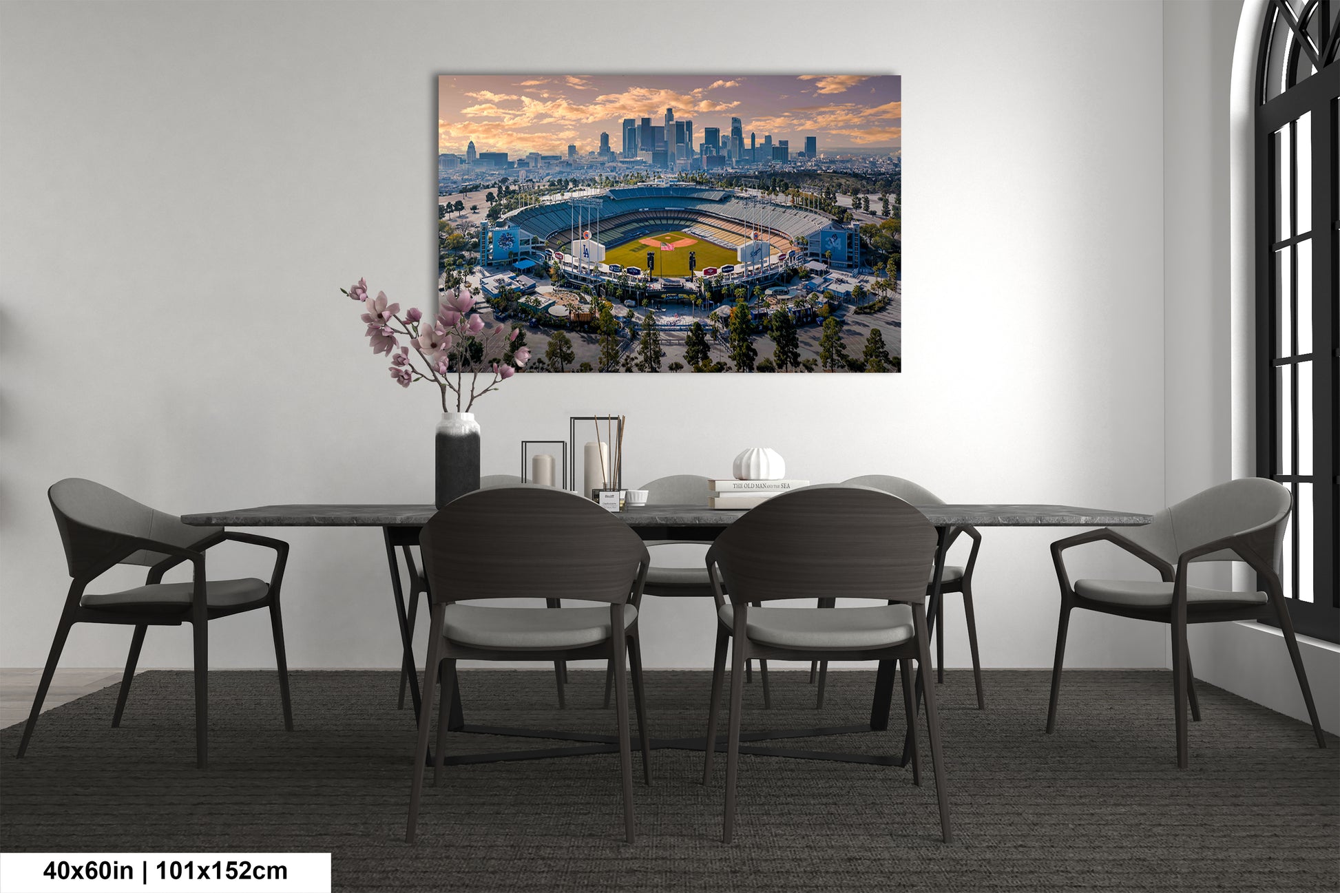 a dining room table with a view of a stadium