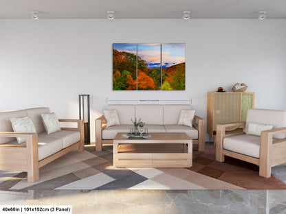 a living room filled with furniture and a painting on the wall