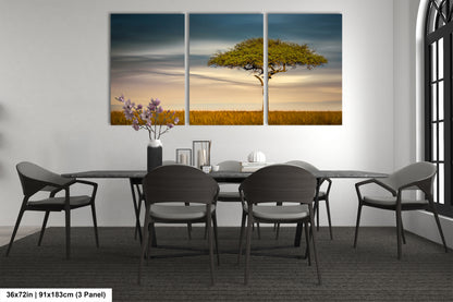 a dining room table with chairs and a painting on the wall
