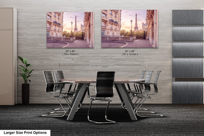 a dining room table with chairs and two pictures on the wall