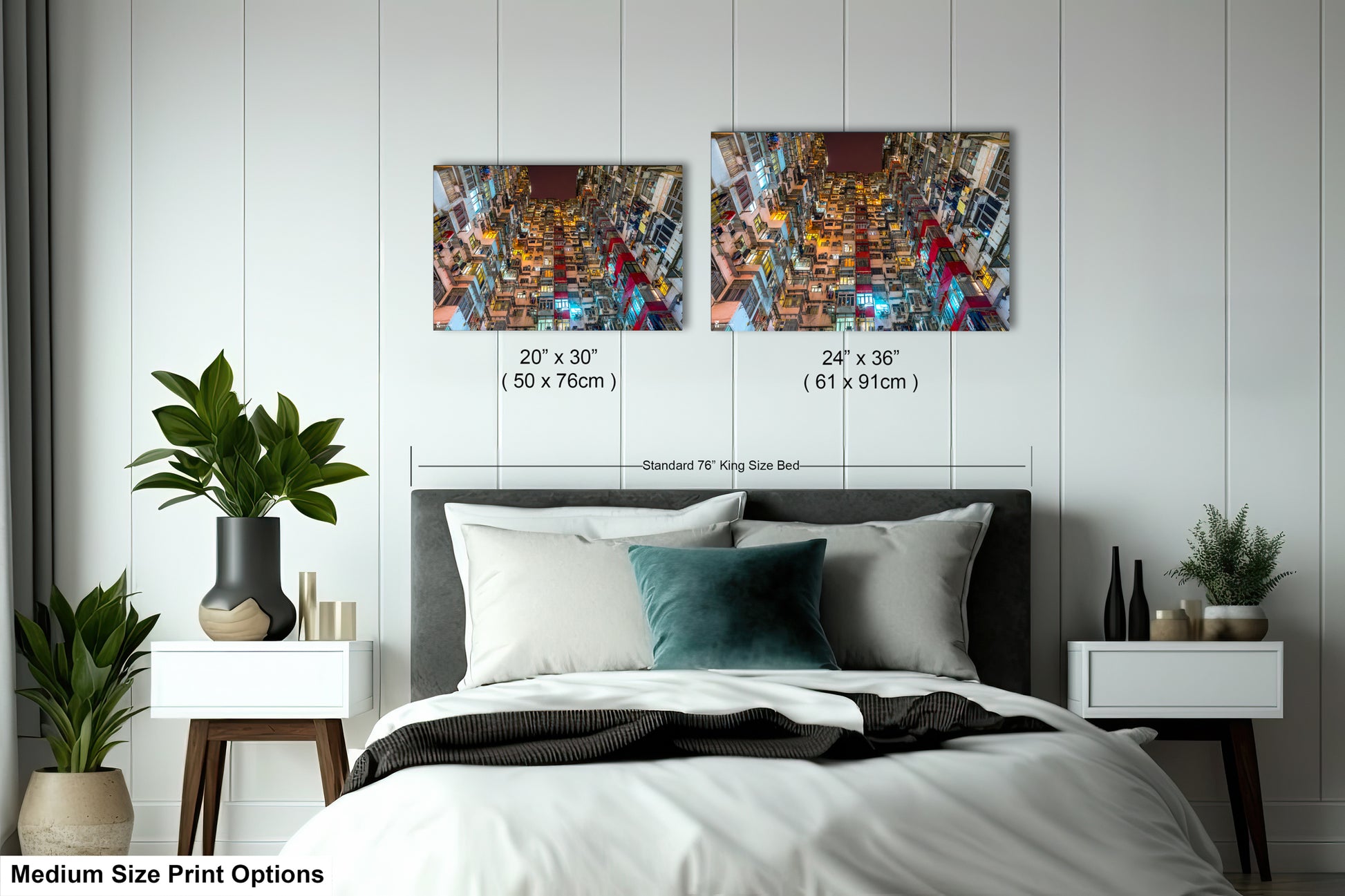 a bed with a white comforter and two pictures on the wall above it
