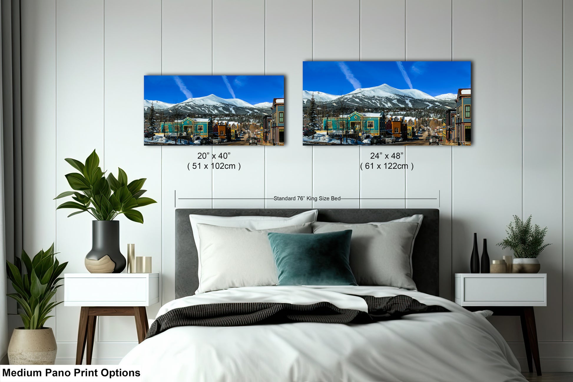 a bedroom with a bed and two pictures on the wall
