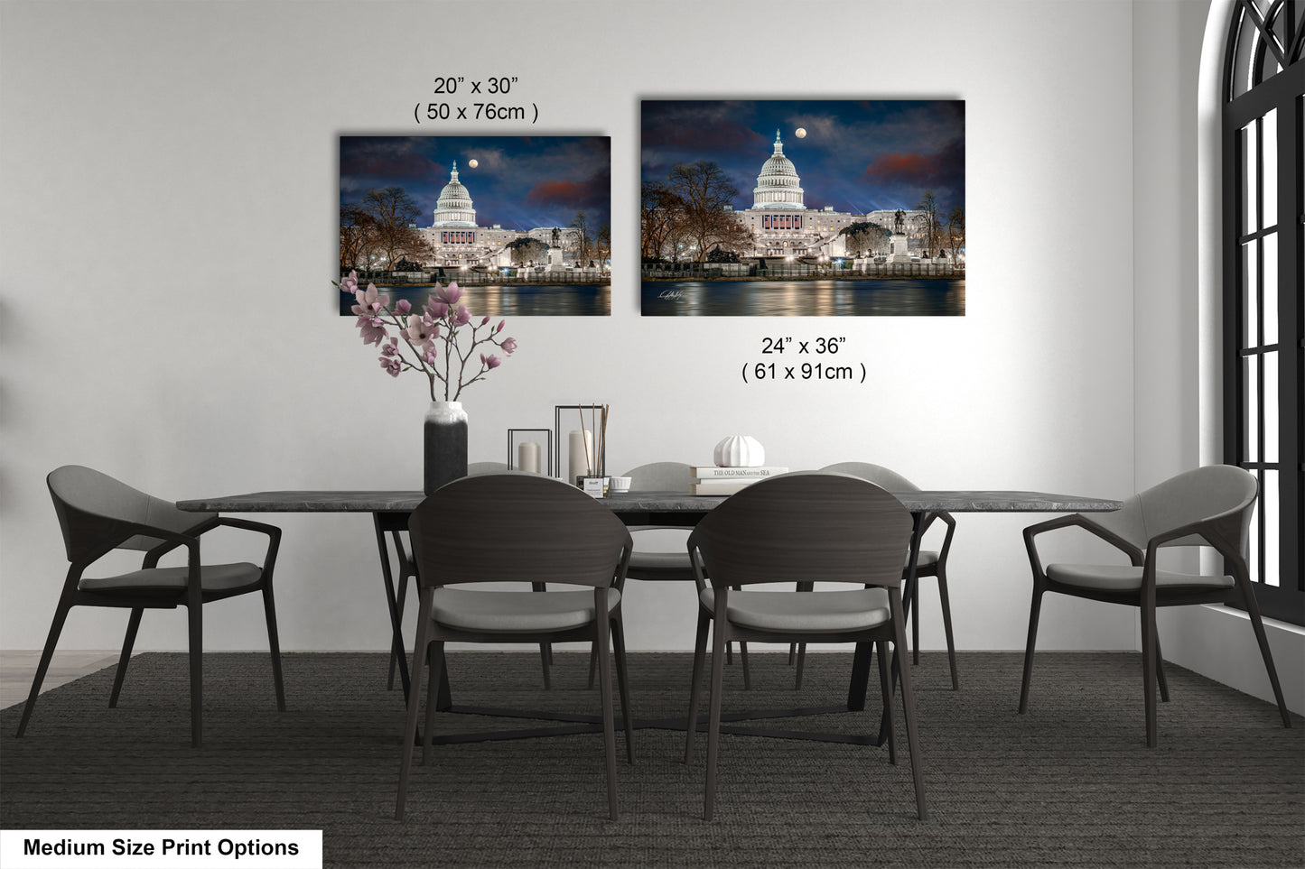 a dining room table with chairs and a vase of flowers