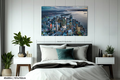 a bedroom with a bed and a painting on the wall
