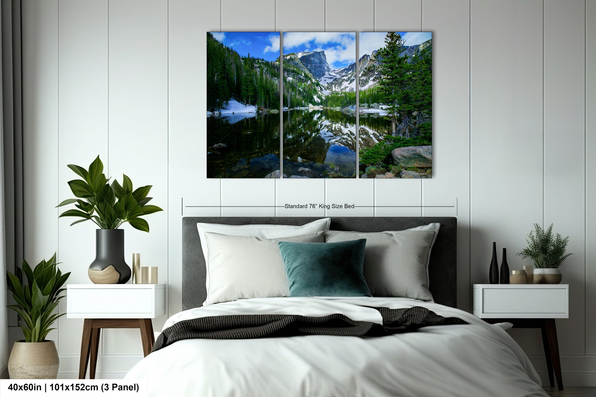 a bedroom scene with a bed and a wall hanging