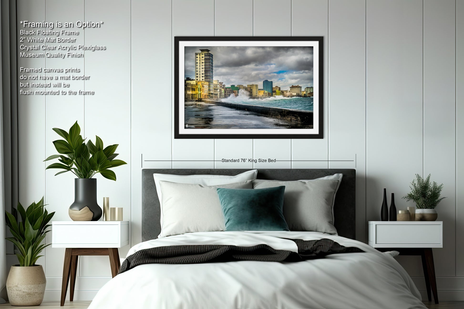 a bedroom with a bed and a picture hanging on the wall
