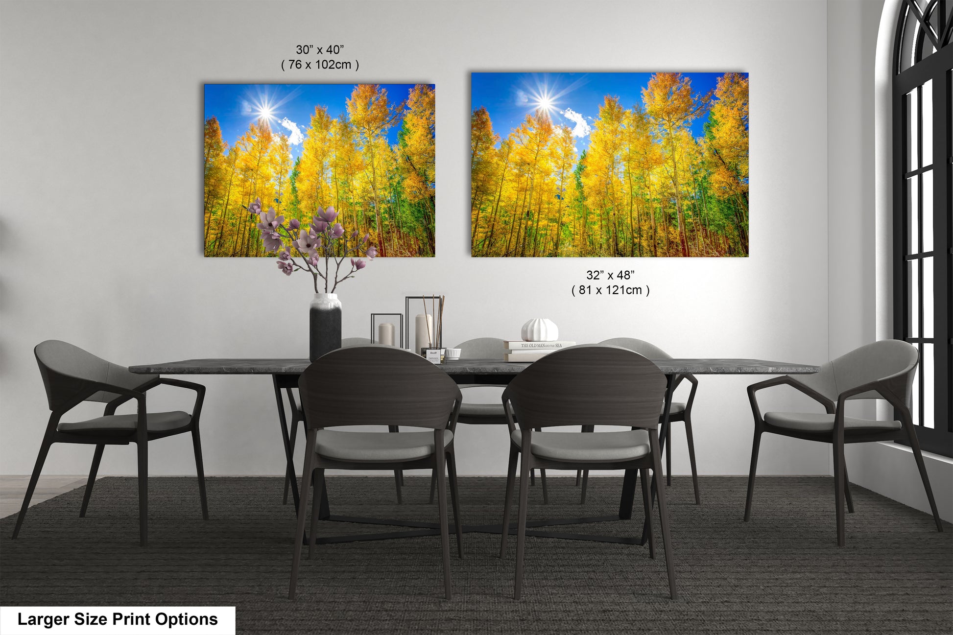 a dining room table with four chairs and a painting on the wall