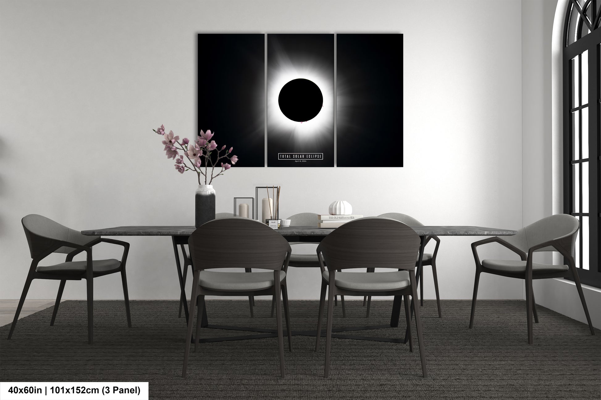 a black and white photo of a dining room